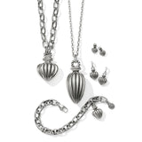 Silver jewelry set including necklace, bracelet, and earrings on a white background