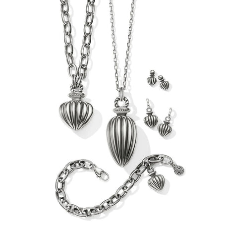 Silver jewelry set including necklace, bracelet, and earrings on a white background