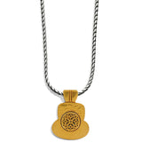 Gold pendant necklace with intricate design on a white background