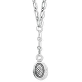 Silver necklace with a round pendant on a white background
