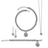 Silver jewelry set with chain necklace, bracelet, and earrings on a white background.