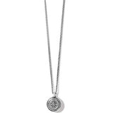 Silver necklace with a round pendant on a white background