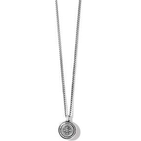 Silver necklace with a round pendant on a white background