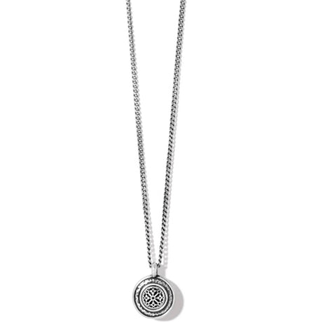 Silver necklace with a round pendant on a white background