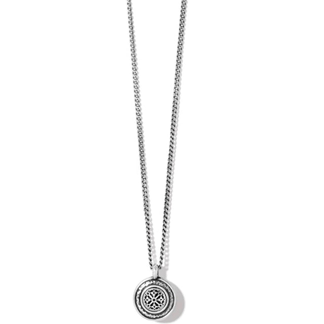 Silver necklace with a round pendant on a white background