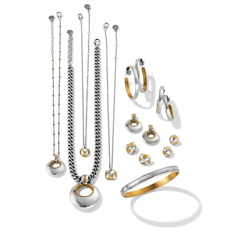 Collection of silver and gold jewelry including necklaces, bracelets, and earrings on a white background.