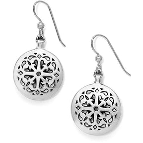 Pair of silver earrings with intricate cut-out designs on a white background