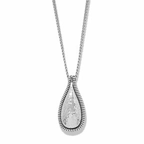 A silver teardrop pendant necklace with a hammered finish and a textured, ribbed border, suspended on a delicate silver chain against a white background.