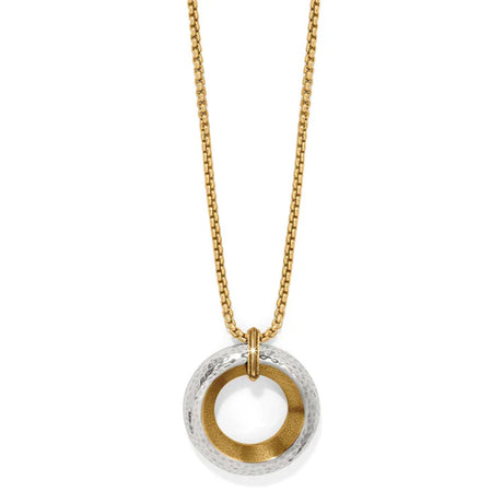 Gold and silver circular pendant necklace on a white background