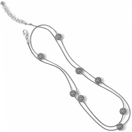 Silver necklace with circular pendants on a white background