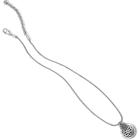 Silver necklace with a heart-shaped pendant on a white background