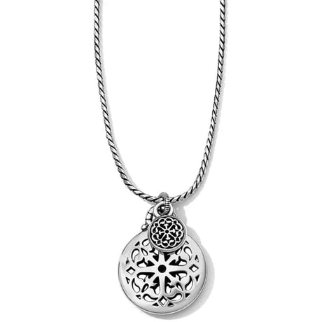 Silver necklace with a detailed pendant on a white background
