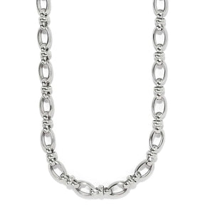 A polished silver-toned metal chain necklace with elongated oval links and smaller connecting beads, shown against a plain white background.