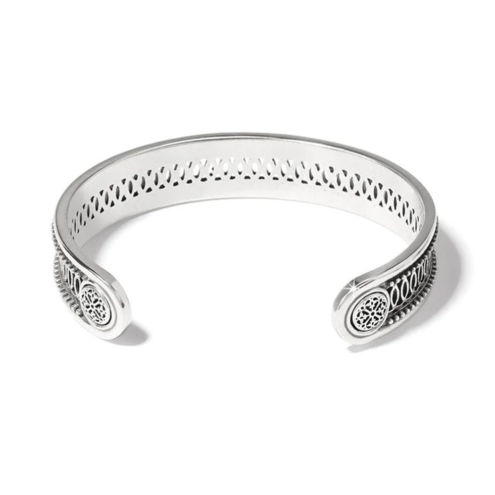 Silver bracelet with intricate designs on a white background