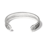 Silver bracelet with intricate designs on a white background