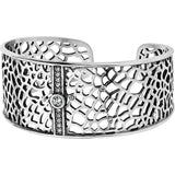 Silver cuff bracelet with intricate design on a white background