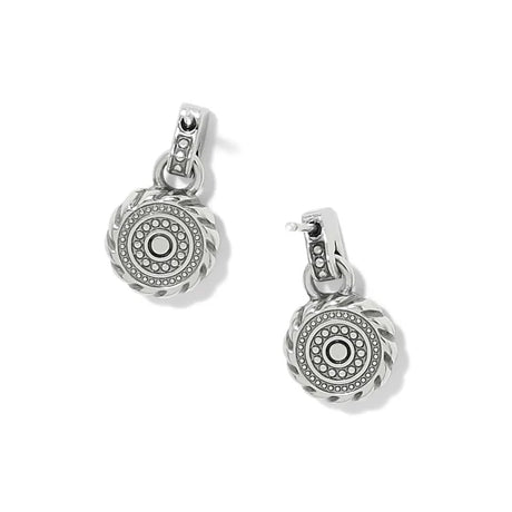 A pair of silver-toned drop earrings with circular medallion charms featuring a textured outer rim, a central round bezel-set stone, and smaller accent stones, shown on a clean white background.