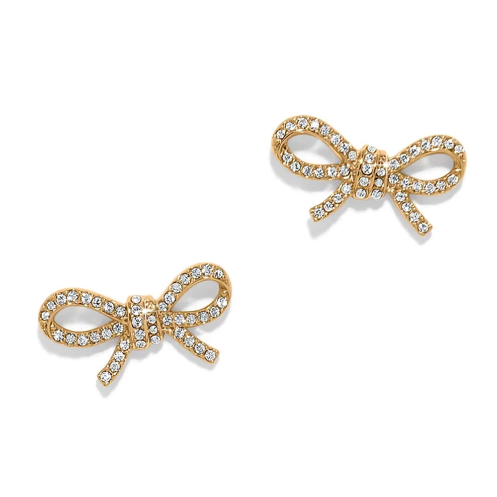 Gold bow-shaped jewelry set on a white background