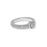 Silver ring with diamond accents on a white background