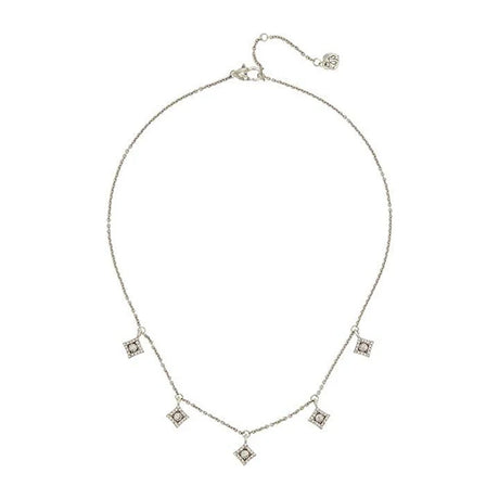 Silver necklace with diamond pendants on a white background