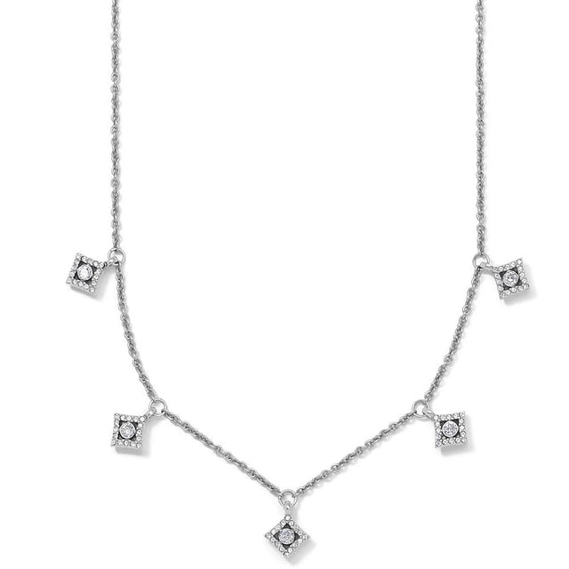 Silver necklace with diamond-like pendants on a white background