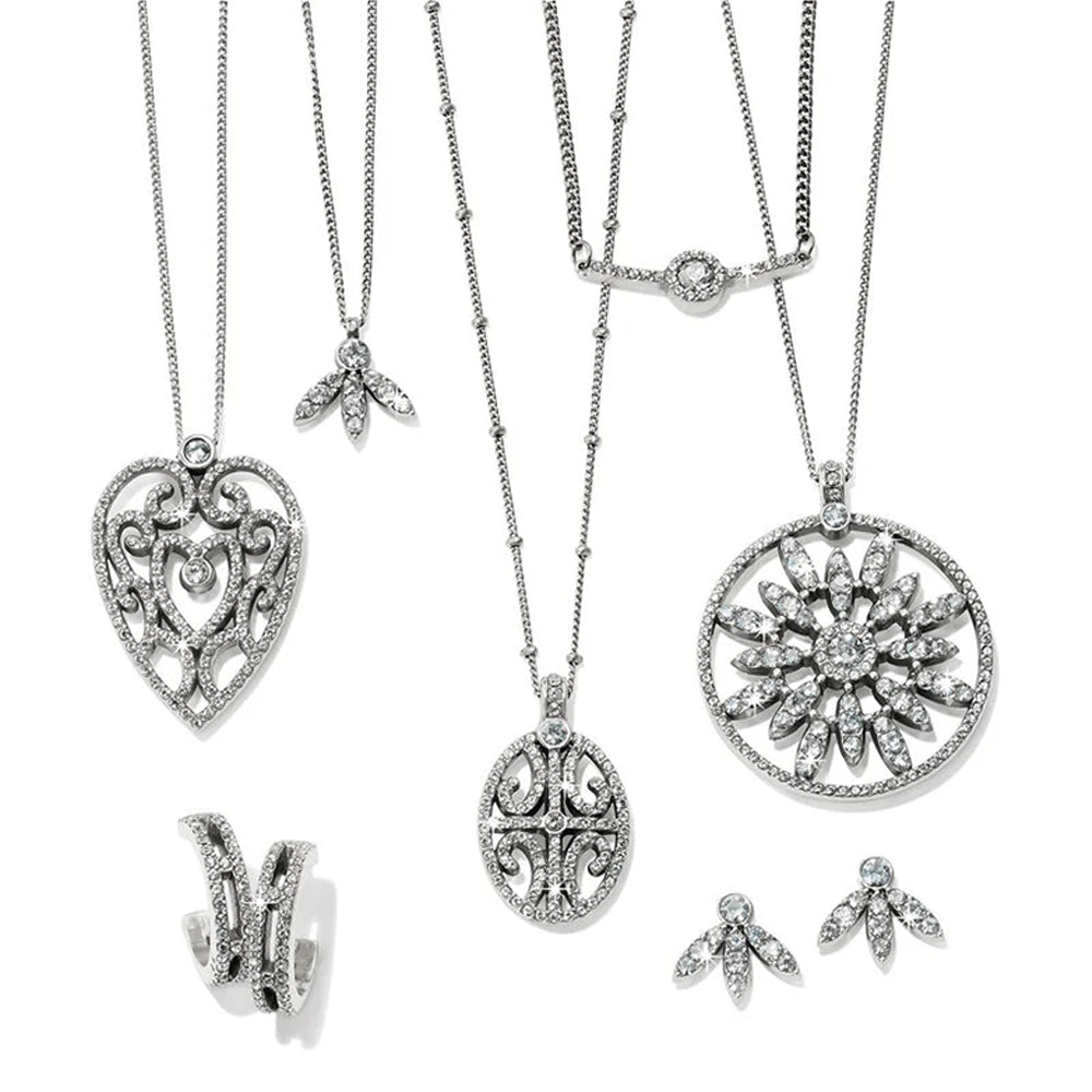 Collection of silver necklaces and pendants on a white background