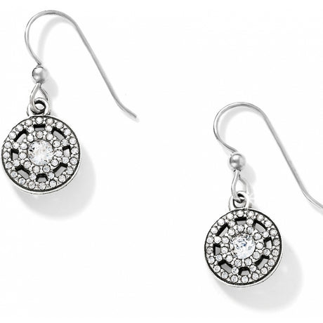 Silver earrings with circular designs and clear stones on a white background