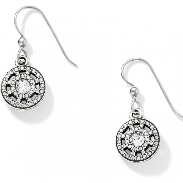 Silver earrings with circular designs and clear stones on a white background