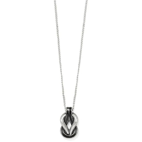 Necklace with a black and silver pendant on a white background