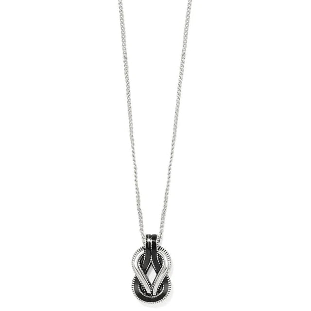 Necklace with a black and silver pendant on a white background