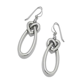 Silver knot earrings on a white background