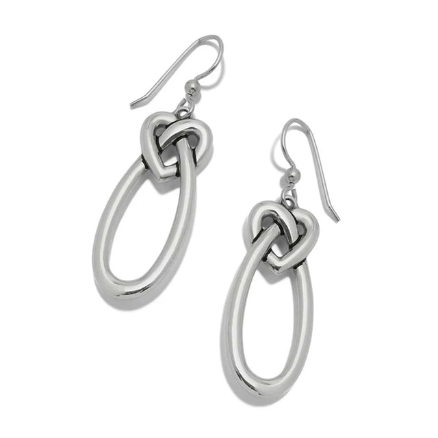 Silver knot earrings on a white background