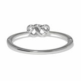 Silver ring with a knot design on a white background
