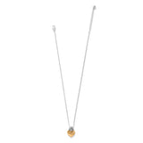 A delicate silver chain necklace with a small heart-shaped pendant featuring a gold-toned center, displayed against a solid white background.