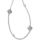 Silver necklace with Celtic knot designs on a white background