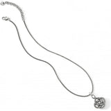 Silver necklace with a intricate pendant on a white background