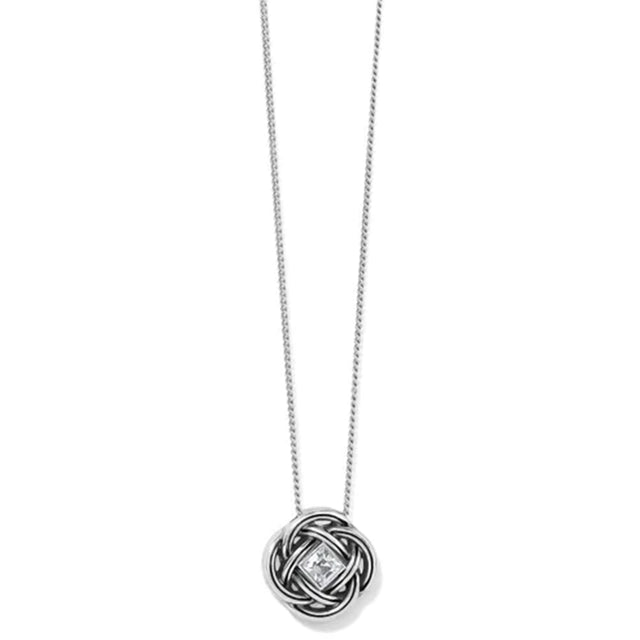 A silver necklace with a circular interwoven knot pendant featuring a small clear diamond at the center, shown against a plain white background.