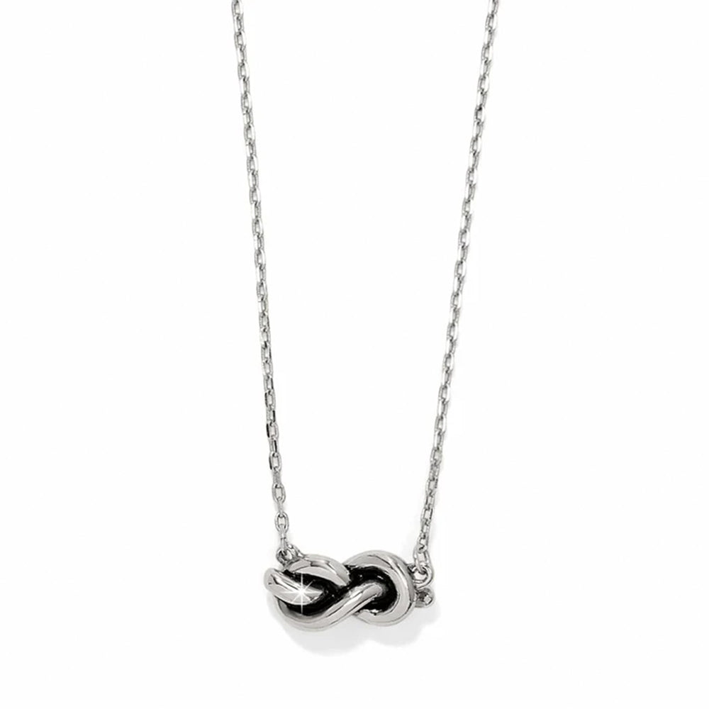Silver necklace with a unique pendant on a white background