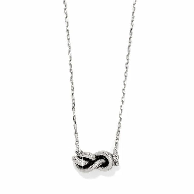 Silver necklace with a unique pendant on a white background