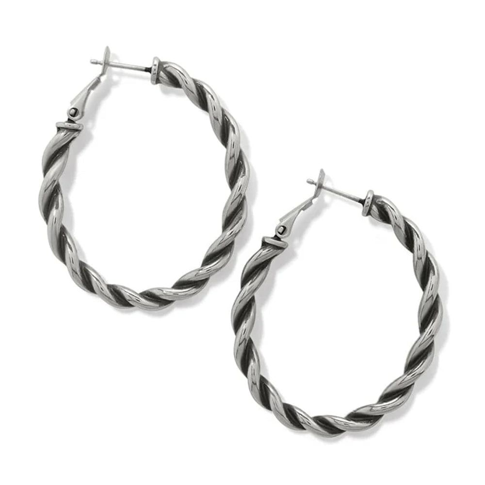 Pair of silver hoop earrings with twisted design on a white background