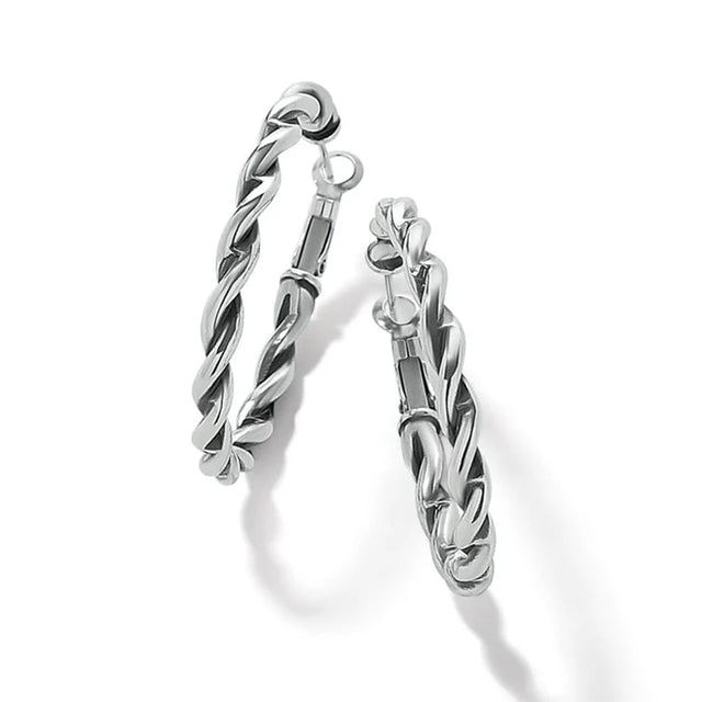 Pair of silver hoop earrings on a white background