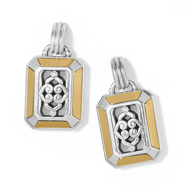 Pair of silver and gold pendants on a white background