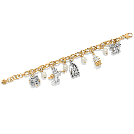 Gold bracelet with various charms on a white background