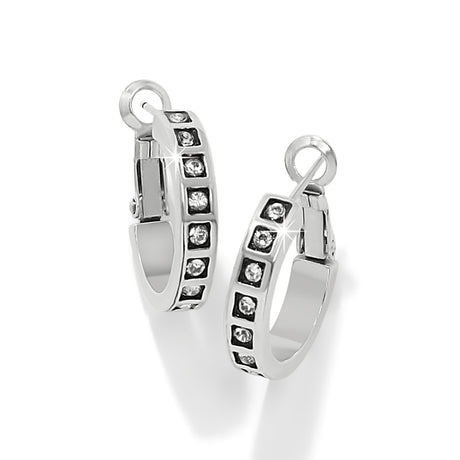 Silver hoop earrings with embedded stones on a white background