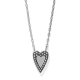 Heart-shaped pendant necklace with clear stones on a white background