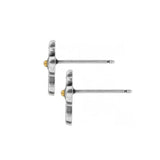 Pair of silver stud earrings with gold accents on a white background