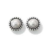 Pair of silver earrings with pearl-like centers on a white background