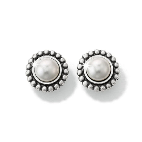 Pair of silver earrings with pearl-like centers on a white background