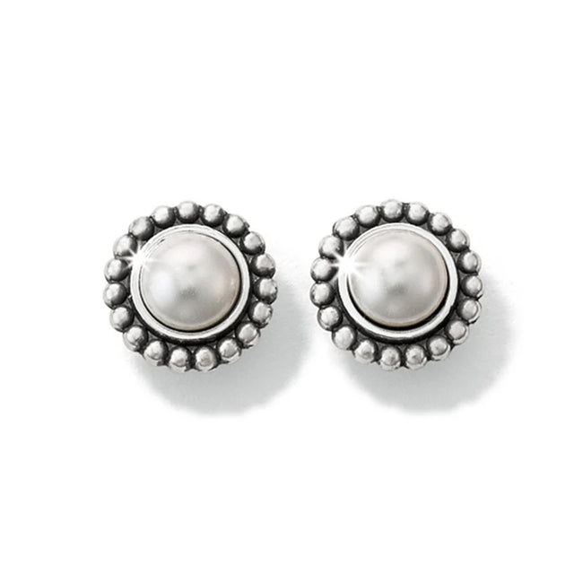 Pair of silver earrings with pearl-like centers on a white background