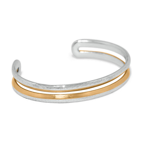 Two-layered silver and gold bracelet on a white background